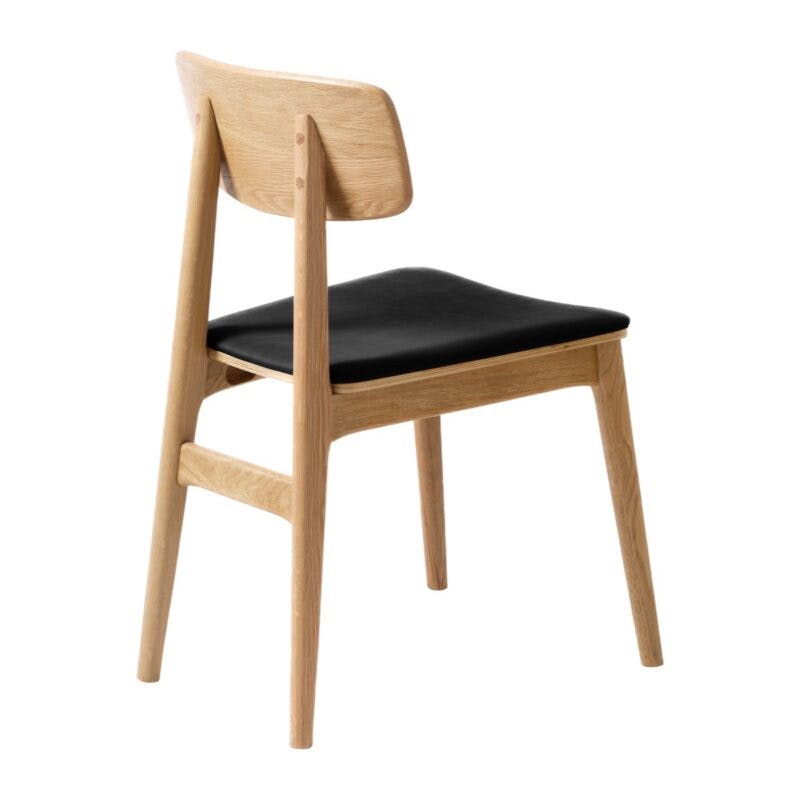 Trendstore Livo Esszimmerstuhl mit Sitzpolster Kunstleder in der Farbe Schwarz – Ansicht schräg hinten